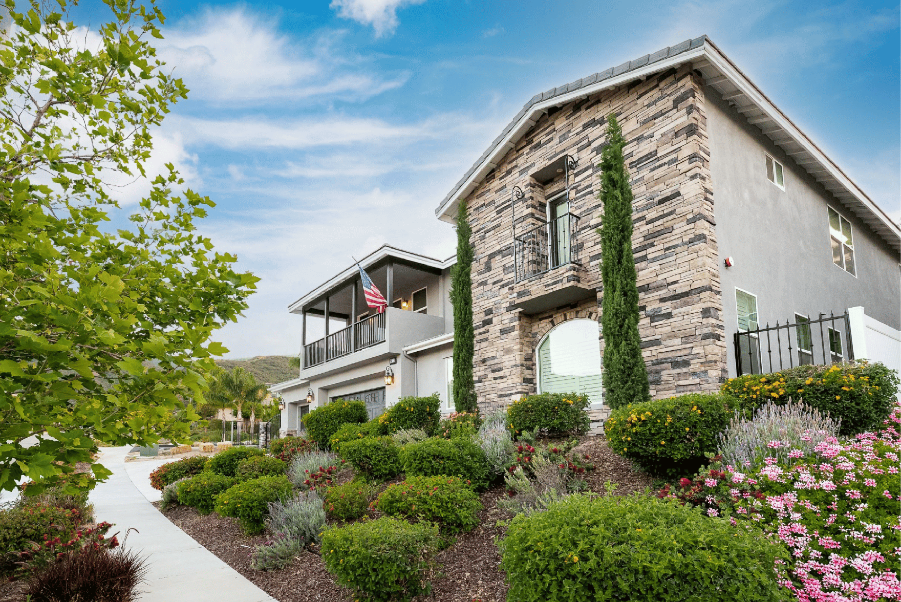 The same home in daylight, with the lighting track color-matched to the trim